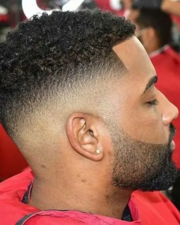 Thick, Black Curls with Mid Fade
